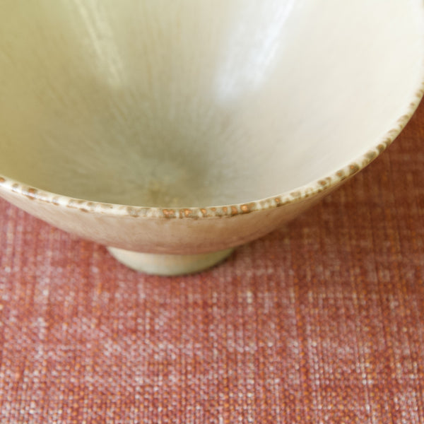 Detail of rim on Carl-Harry Stålhane's SHX bowl with pale-yellow glaze, Rörstrand 1955, exemplary Scandinavian design.