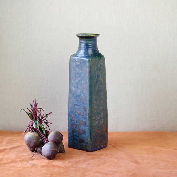 Still life mood shot showing an impressive unique mid-century modern Finnish art vase alongside beetroot. 1960s Francesca Mascitti Lindh vase produced at Arabia Finland, featuring rustic forms with bold, modern glazing techniques.