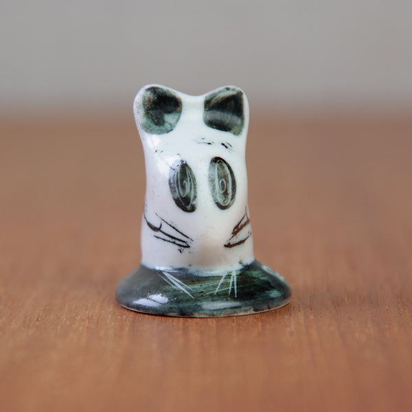 Close-up of Susan Parkinson's 1956 mouse figurine showing the abstract swirl eyes, a defining feature of her work.