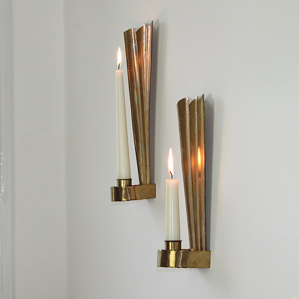 Carl Malmstedt brass wall sconces from Ängelholm, Sweden, 1932-1933, with a Tre Kronor motif for stunning light effects and mid-century Scandinavian design.