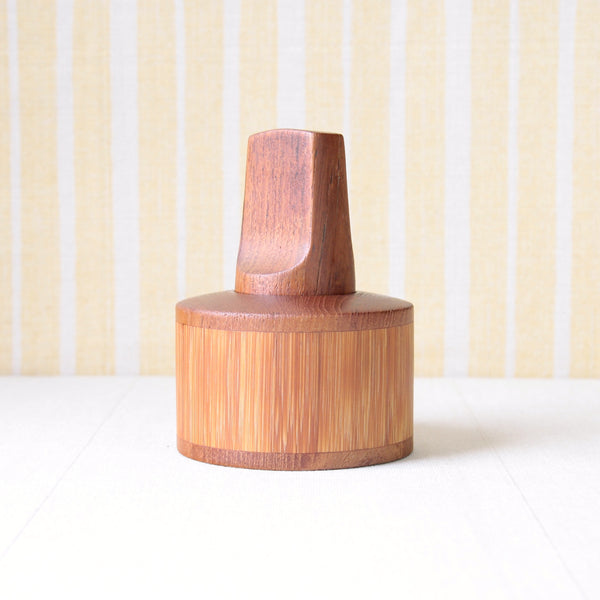 Teak and bamboo pepper mill by Jens Quistgaard, a Nordic design icon from the Cane and Teak series. Available for sale from Art & Utility, a London-based gallery.
