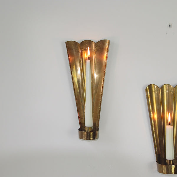 Rich patination in Carl Malmstedt's 1932-1933 brass wall sconces, featuring the Swedish Tre Kronor motif and mid-century Scandinavian design.