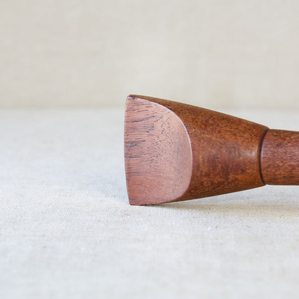 Detail of a Jens Quistgaard "Screwdriver" pepper mill in solid teak wood. This design was executed in the 1950s, it is a classic example of organic Scandinavian Modernism.