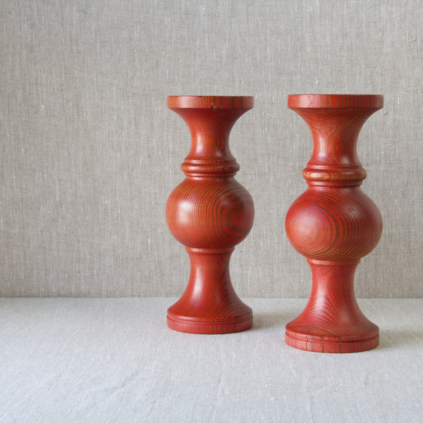 Inspired by traditional Swedish crafts, a pair of red pine large candlesticks by lena Larsson 1960's