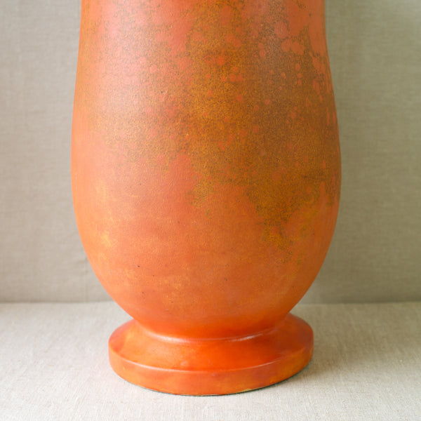 Classic Danish modern ceramics: an orange uranium-glazed vase from Kähler Pottery.