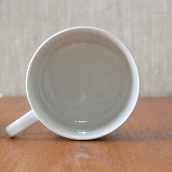 Detail of the inside of a Rörstrand cup. The cup is white with a clear overglaze. An extremely rare Marianne Westman ‘King’ cup and saucer for Rörstrand. Owning this duo allows one to connect with the past, appreciating the creativity and talent that flourished during the golden age of Scandinavian design.