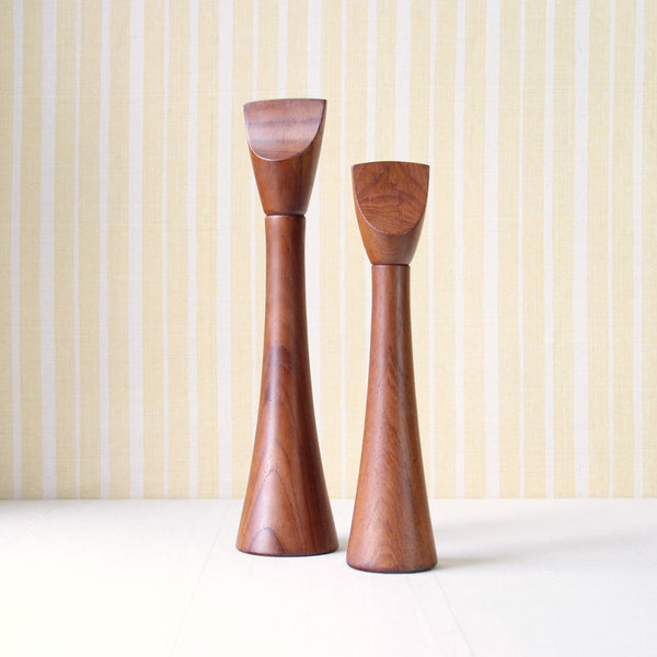 Mood image of Jens Quistgaard Dansk teak pepper mills. This pair is nicknamed "Screwdriver". The design is early, dating from the late-1950s. For sale in London from Nordic design gallery Art & Utility.