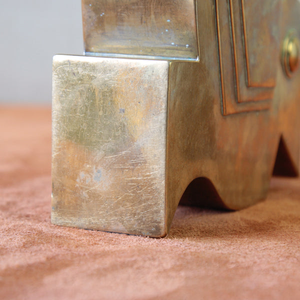 Geometric brass bird sculpture in Art Deco style with a bud vase, influenced by Bauhaus design. A unique collectible from the 1930s.