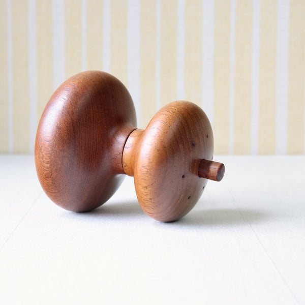 Jens Quistgaard's teak hourglass pepper mill, model 822, featuring a unique Organic mid-century modern Nordic silhouette.  .