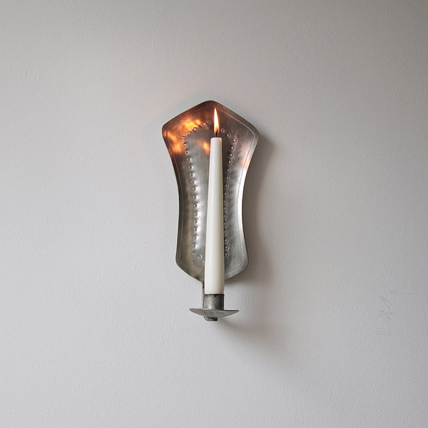 Unique pewter wall sconce handcrafted in Finland, circa 1940, showcasing Finnish handicrafts and mid-century Scandinavian design.