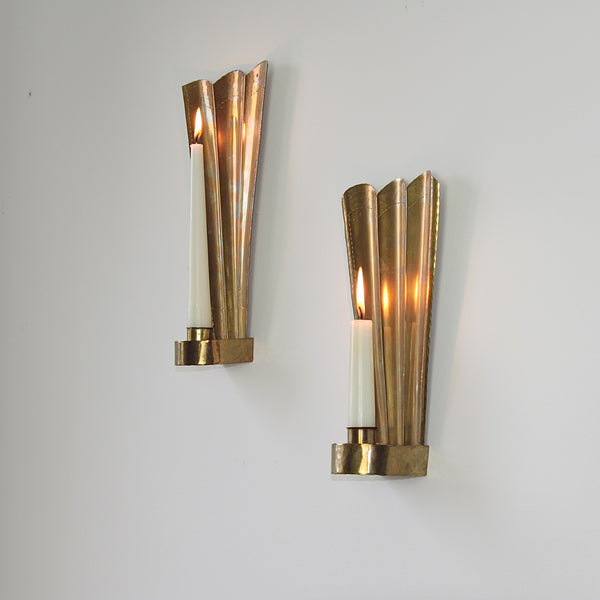 Three Crowns (Tre Kronor) motif brass wall sconces by Carl Malmstedt, handcrafted in Sweden in 1932 and 1933, exemplifying twentieth century Swedish metalware.