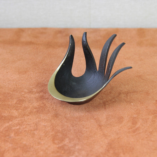 Mid-century Modern brass hand ashtray by Walter Bosse in his signature black-golden line 