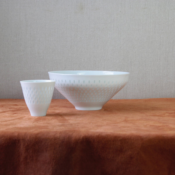 Still life mood image showing two handmade porcelain bowls by Friedl Holzer-Kjellberg with rice grain technique, rare vintages example of Scandinavian design at its best. For sale in London from Art & Utility.