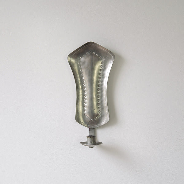 1940s Finnish pewter wall sconce, inspired by Paavo Tynell, a stunning example of Finnish handicrafts and nordic design.