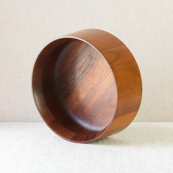 JHQ Quistgaard tapered circular bowl laying on it's side, showing the rich colour and lively grain in the wood