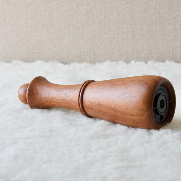 Side view of an elegant organic modern pepper mill designed by Jens Quistgaard, this design rarely seen in the UK where it is available to view at Art & Utility by appointment. 