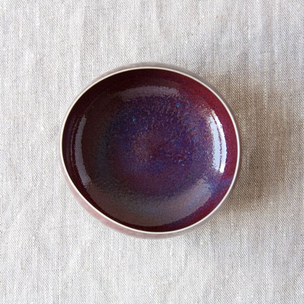 Ariel view of a Carl Harry Stalhane sang de boeuf ox blood ceramic bowl which comes accompanied by a hand-signed certificate which denotes the model number for this unique bowl is geo34. Available from online design gallery Art & Utility London.