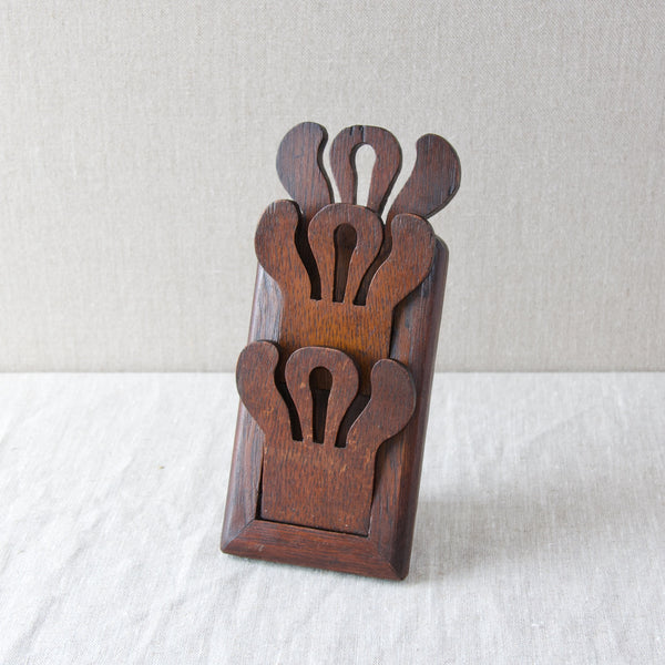A miniature freestanding carved oak letter rack or postcard tidy handmade in the UK in beginning of the twentieth century.
