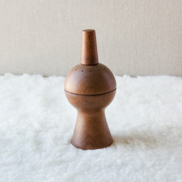 A sculptural Jens Quistgaard pepper mill, designed in the late-1950s. Danish sculptor and designer Quistgaard is best known for these peppermills and his other work in teak for the American company Dansk Designs, where he was chief designer from 1954 and for the following three decades.