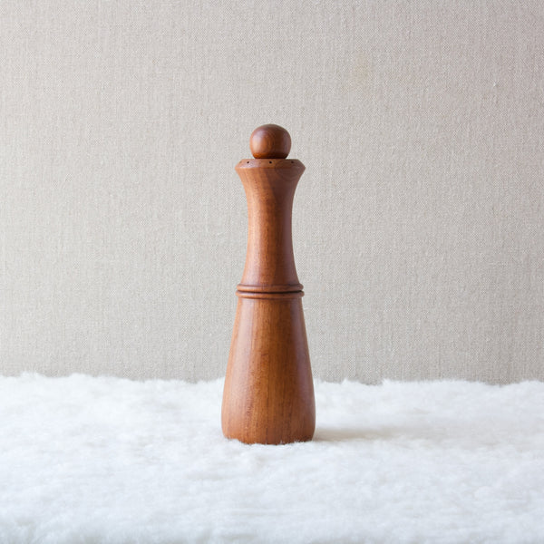 Profile image of a slender Modernist Scandinavian pepper mill in teak, design by Jens Quistgaard who was born in Denmark but lived for many years in the USA where he was artistic director of Dansk Designs.