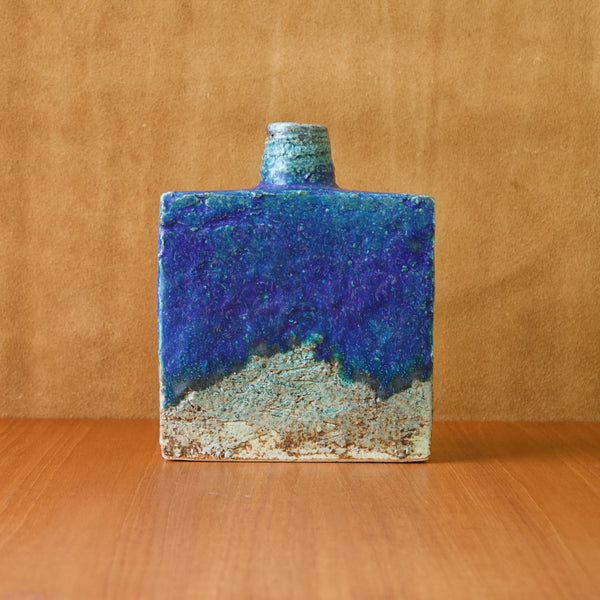 Annikki Hovisaari square bottle vase hand made from rough textured chamotte clay at the Arabia art department in the mid-1960s. Work such as this secured Arabia's place on the international market and saw Finland win multiple design awards.