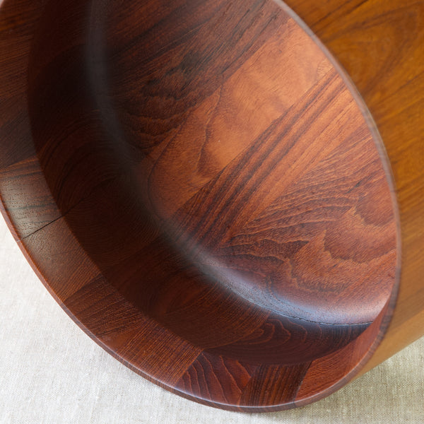 Detail of staved teak wood grain on a mid century modernist circular bowl by Jens Quistgaard, Denmark