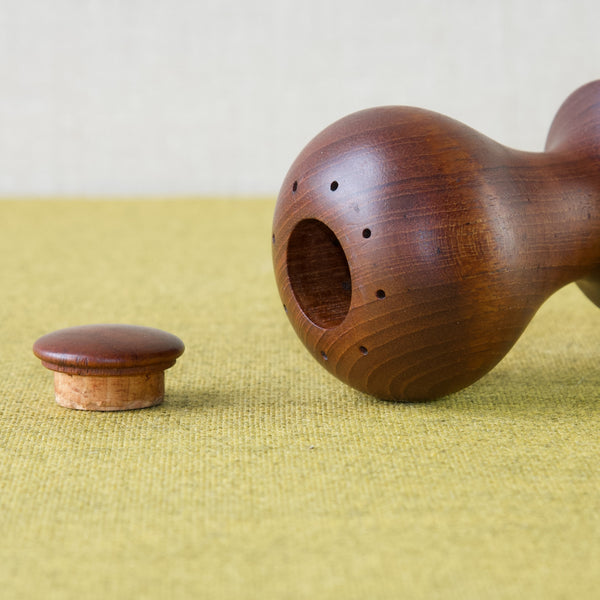 Detail showing the top of a model 890 Hourglass pepper mill designed by one of Denmark's most prolific designers of the twentieth century, Jens H. Quistgaard who uses the monogram signature IHQ.