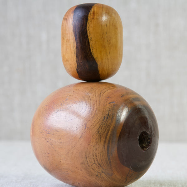 Detail shot showing the impressive wood grain on a pair of lignum vitae plumber's bobbins.