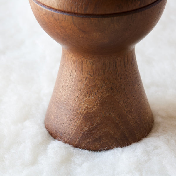 Detail showing the foot of a Jens Quistgaard pepper mill. The combination salt and pepper mill is made in high quality solid teak. Hand carved in Denmark in the 1950s.