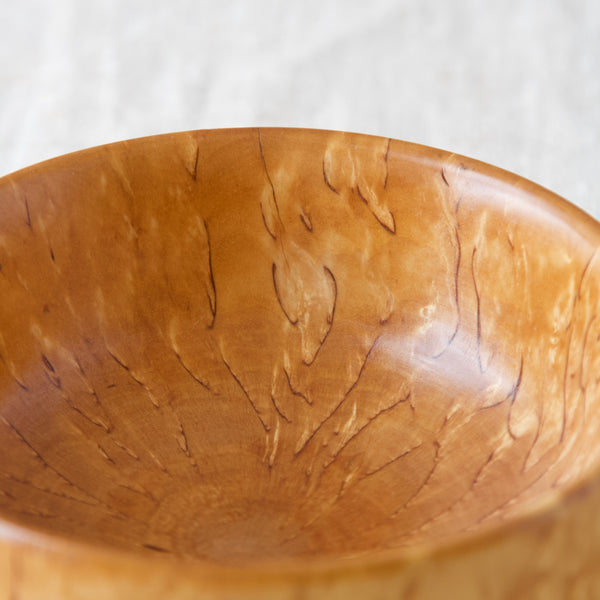 Close up of the magnificent sunburst flames in turned Karelian birch wood bowl made in Scandinavian in the 1960s. Vintage folk art, crafts and collectable design available on Art & Utility, London.