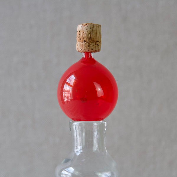 Close up of a corked red glass stopper for rare Kaj Franck k503 decanter