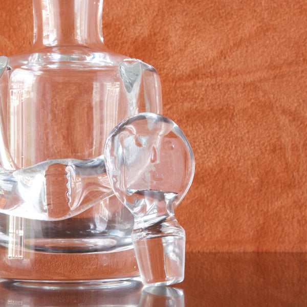 detail of pressed glass face stopper for Erik Höglund clear glass person decanter, designed in the 1950's 