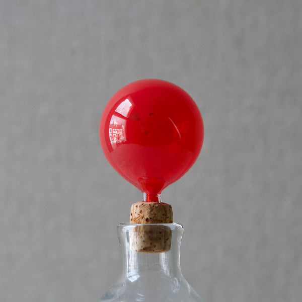 Detail of red spherical glass stopper for a modernist Scandinavian decanter from Nuutajarvi Notsjo, Finland, designed by Kaj Franck