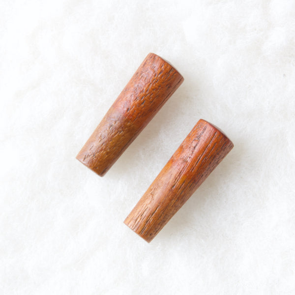 Detail of teak stoppers or plugs for Dansk Designs JHQ pepper mill by Jens Quistgaard