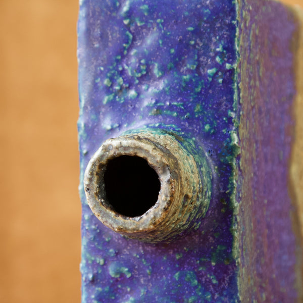 Zoomed in image showing the circular opening or mouth of a bottle vase or pullo maljakko designed by Annikki Hovisaari one of the esteemed names in mid-twentieth century Scandinavian design history.