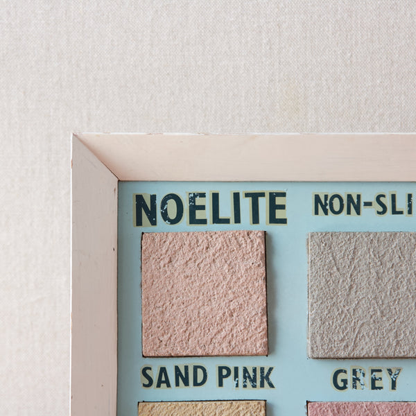 Close up showing the mid-century modern lettering of the Noelite company's name on this mid-century British sample board advertising paving stones or slabs