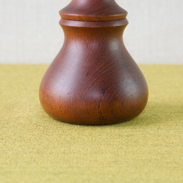 Close up showing the beautifully striped grains on a solid teak wood pepper mill designed by Jens Harald Quistgaard who was the Design Director of Dansk Designs Ltd for decades.