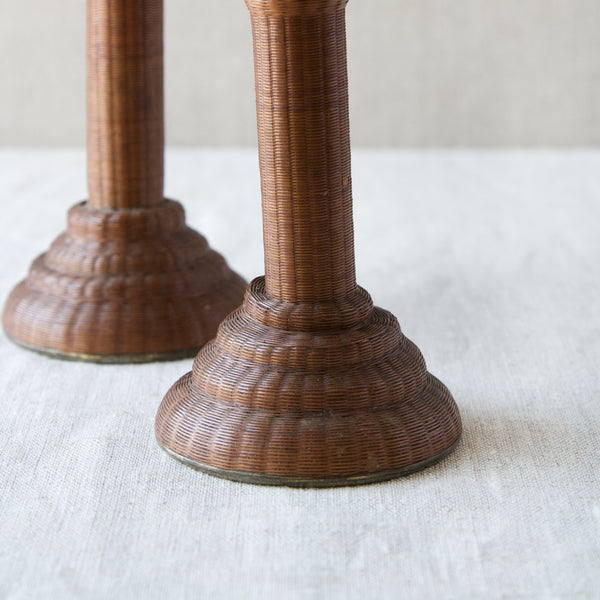 Close up showing the bases of a pair of 18th Century candlesticks which have, unusually, been covered in woven cane rattan. Phenomenal example of antique wickerwork.
