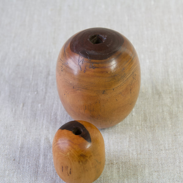 Zoomed in image showing age related wear to an antique plumber's bobbin made from lignum vitae. These British antique collectors items and many more are available to buy from Art & Utility, London.