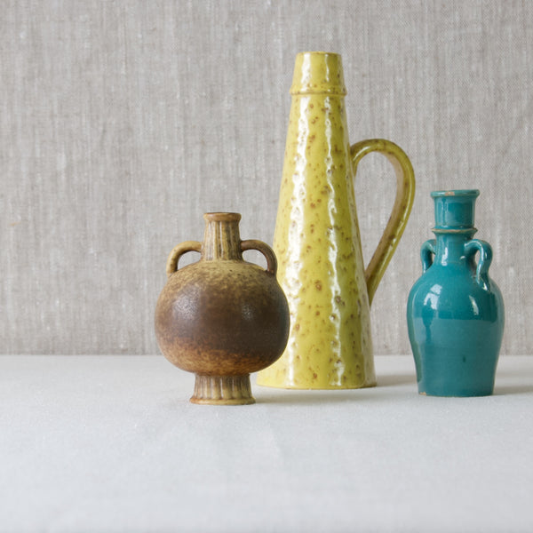 Group of colourful ceramics including Rorstrand Gunnar Nylund vase with Nittsjo Jerk Werkmaster vase and blue ancient chinese handled vase