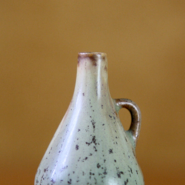 detail of miniature handled Rorstrand vase with green glaze