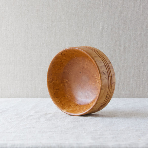 A Karelian birch bowl. Although somewhat temperamental to work with, Karelian birch is commonly used for turned objects in Scandinavian as this is how the beauty of the grain is best exploited.