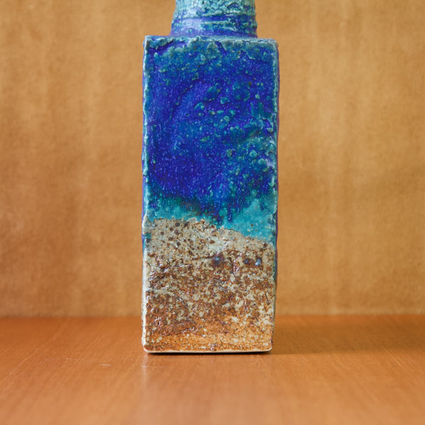 Detail view of the slim side of a slab built vase by Annikki Hovisaari. The glaze is predominantly cobalt blue but also contains splashes and speckles of azure and lapis.