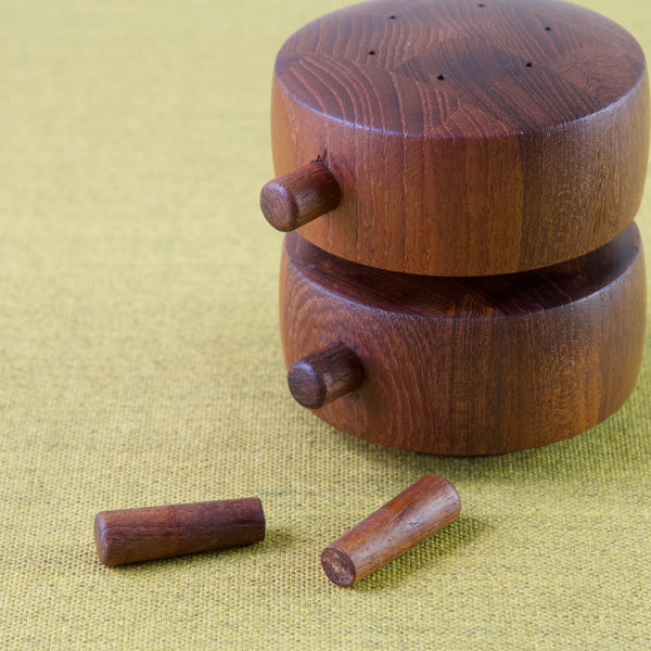 Jens Quistgaard IHQ barrel-shaped peppermill, model 824, showing teak pegs removed to insert salt or pepper