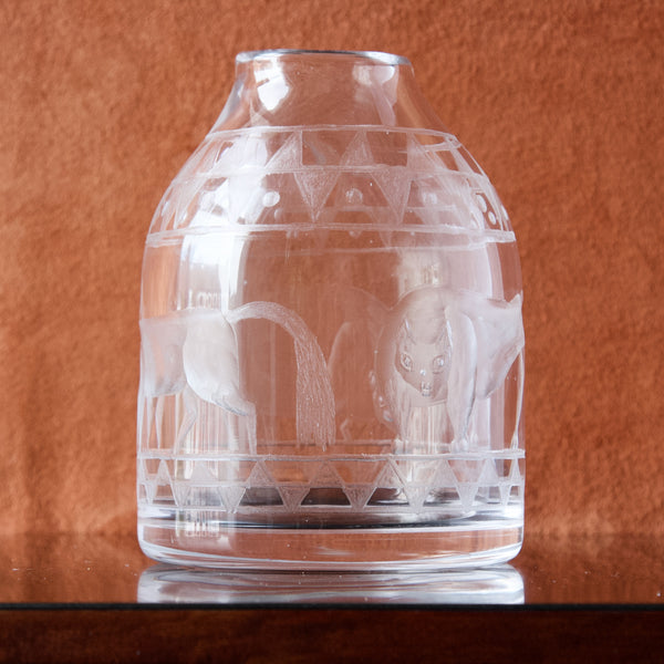A Swedish clear glass vase engraved with the weird and wonderful designs of Erik Höglund, this early piece dates from circa 1955.
