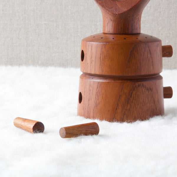 Mid Century teak pepper mill from Dansk designed by Jens Quistgaard showing teak plugs and plug holes