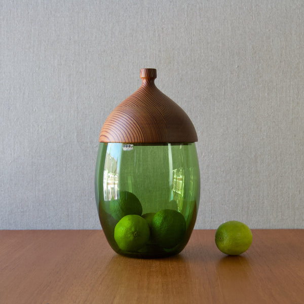 An Erik Hoglund green "Acorn" jar containing limes