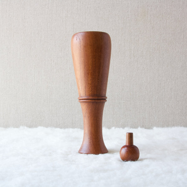 A Dansk Designs pepper mill upside down and with stopper removed. This angle shows that a carafe bottle shape could have been Jens H. Quistgaards inspiration behind this design which is one of sixty in the pepper mill series.