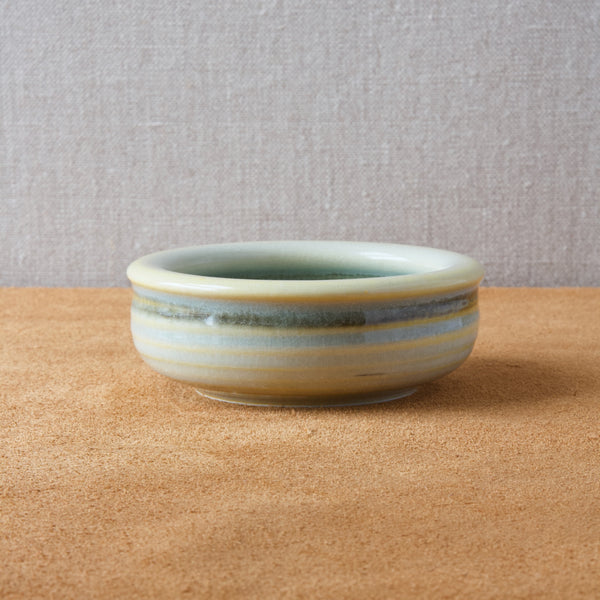 Scandinavian studio pottery bowl by Olle Alberius with yellow celadon glaze