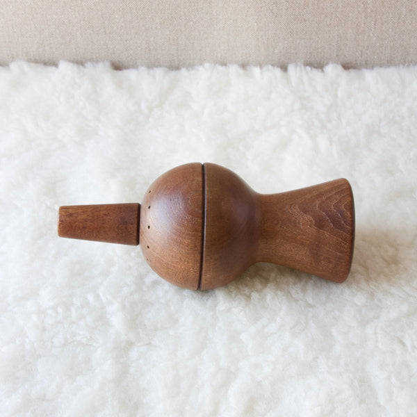 Top view of a Jens Quistgaard pepper mill laying on its side. This highly geometric ball and cone design is both an early and rare design by Jens Quistgaard.